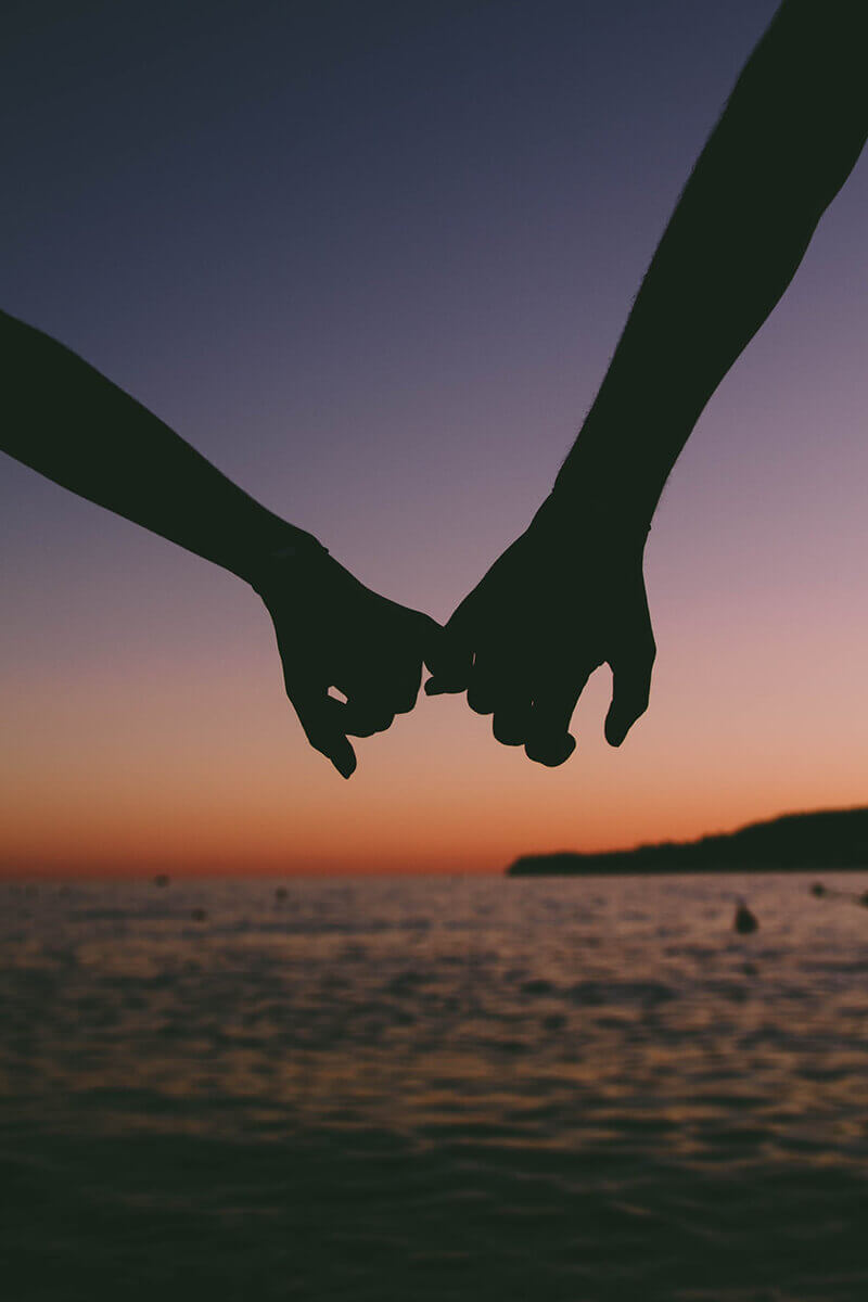 Photo of a couple holding hands